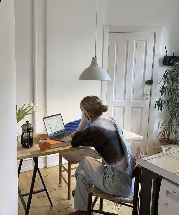 A person speaking privately from home